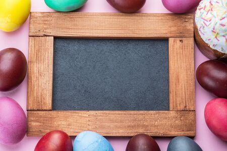 Colorful Easter eggs as an attribute of Easter celebration. Pink background.の写真素材