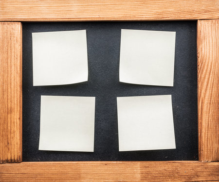 Blackboard and post-it notes stuck to the front.