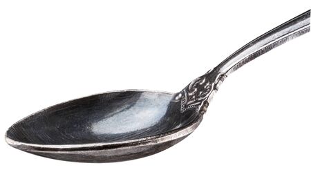 Old siver spoon on white background close-upの写真素材