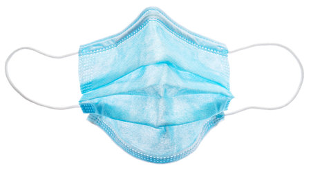 Medical mask isolated on white background. A persistent attribute of the pandemic.