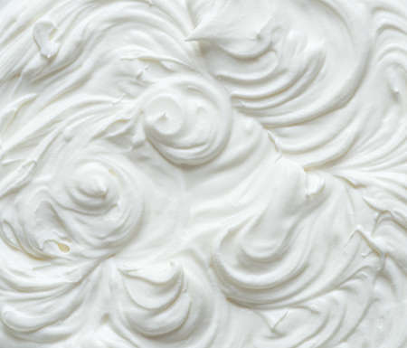 Creamy pics in yoghurt or cream surface. Top view.の写真素材