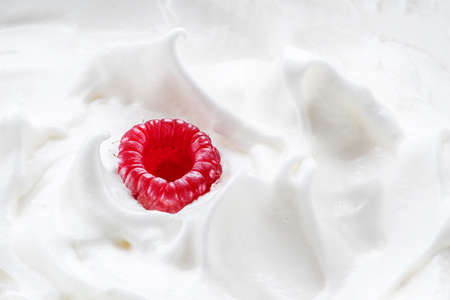 Fresh raspberry in the yoghurt or cream. Top view.の写真素材
