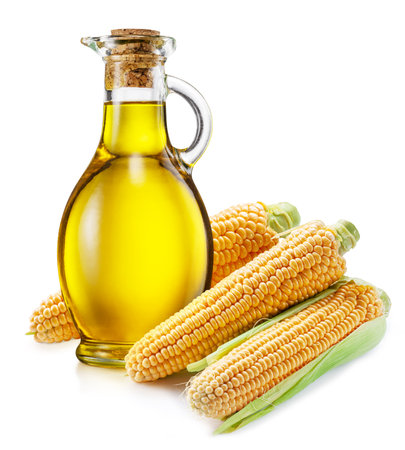 Bottle of maize oil corn ears isolated on white background. The most popular of vegetable oils.の写真素材