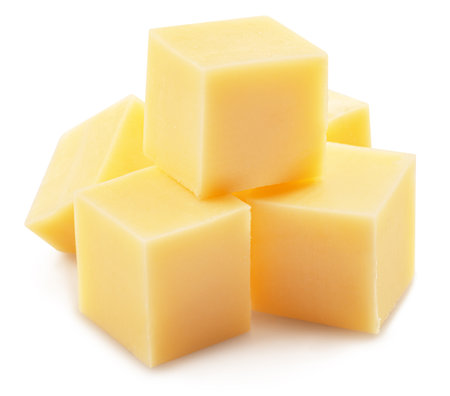 Pyramid of cheese cubes isolated on white background.の写真素材