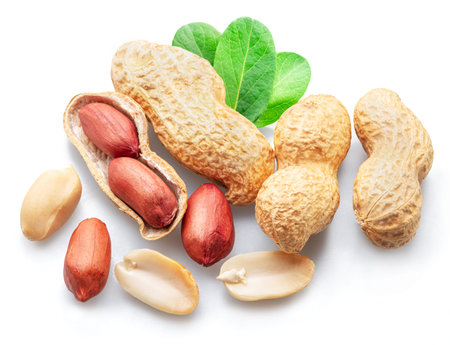 Peanuts whole and cracked isolated on white background.