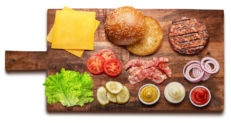 Cheeseburger or hamburger ingredients on wooden board.の写真素材