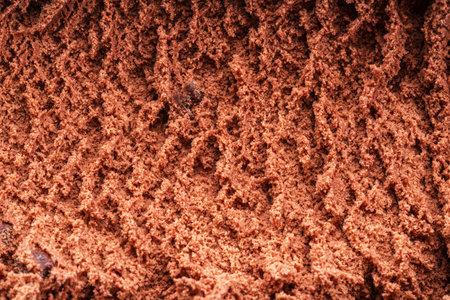 Structure of frozen chocolate ice cream close up. Ice cream background.