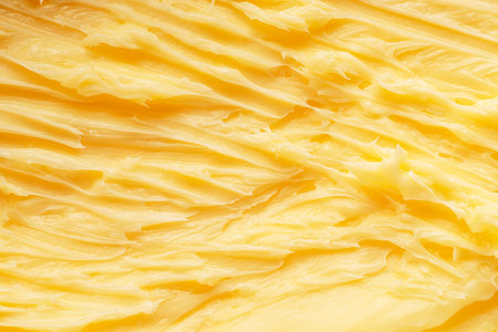 Soft melted rippled butter surface. Macro shot.の写真素材