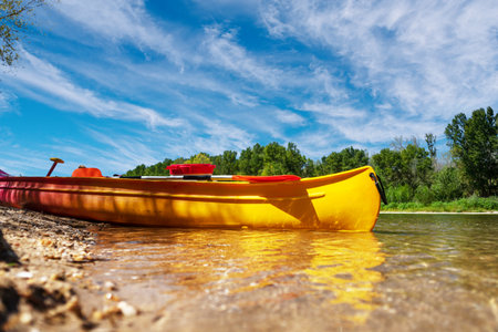 Kayaking on the river in the summer. Kayak with puddles at foreground.の写真素材