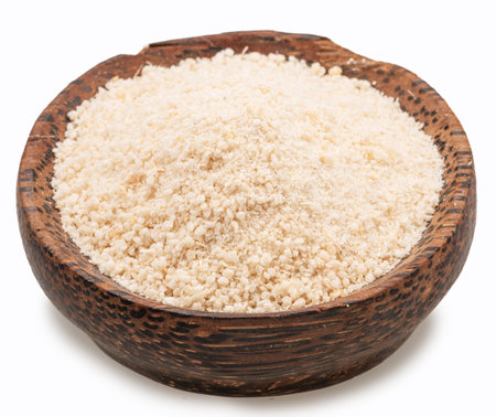 Manioc or cassava flour in wooden bowl on white background.の写真素材