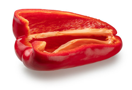 Half of red bell pepper cut in longitude, isolated on white background. File contains clipping path.の写真素材