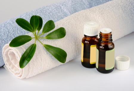 Essential oil bottles and towelsの写真素材