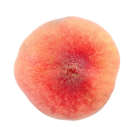 Flat peach isolated on white, high angle viewの写真素材
