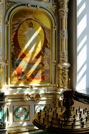 Valaam Island, Karelia, Russia - June 12, 2014: Fragment of earthenware iconostasis with icons of Christ. Extraordinary light, airy, porcelain iconostasis is framed in gold.のeditorial素材