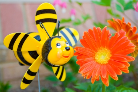 Cheerful garden bee and a flower の写真素材