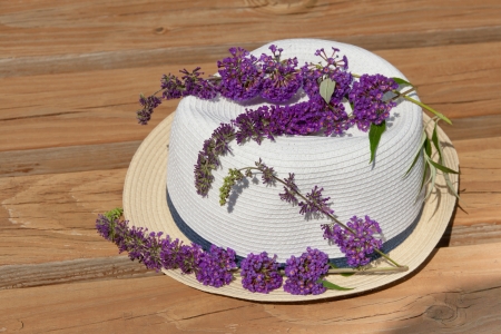 Butterfly bush blossom on summer hat at garden  Summertime concept の写真素材