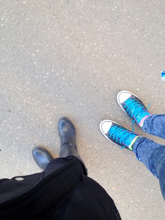 Feet of people wearing boots and sneakersの素材