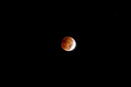 Blood Moon.  Lunar eclipse as seen in the night sky on October 7, 2014. Kentucky, USA.  Some...