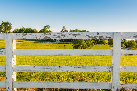 Weathered white wooden horse fence on country site.の写真素材