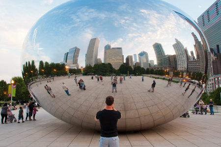 CHICAGO, IL USA - AUGUST 26, 2011: Cloud Gate and Chicago skyline. Cloud Gate is the artwork of...