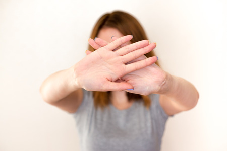 woman showing a stop gesture with palmsの写真素材