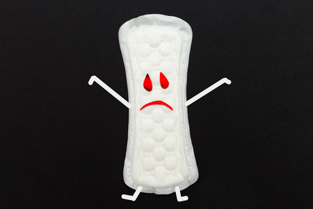 menstruation concept. an image of a menstrual pad on red backgroundの写真素材