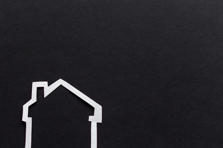 Buying a new house concept, an image of a house on dark backgroundの写真素材