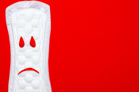 menstruation concept. an image of a menstrual pad on red backgroundの写真素材