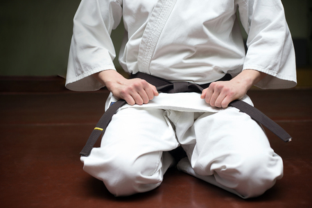 male martial arts coach in a gym in kimonoの写真素材