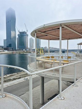 Vienna, Austria - January 2, 2025: an outdoor terrace with pergola in a waterfront park by the river...