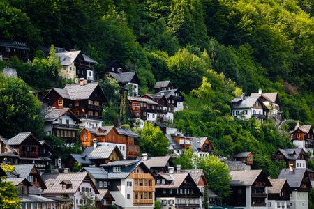 Classic alpine houses on a hillside in Hallstatt village, illustrating European small town charm with a classic summer atmosphere.