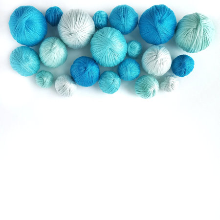 Blue balls of yarn isolated on white background.