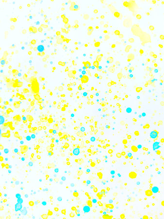 Splash yellow and blue paint on white paper background.