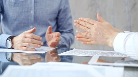 Unrecognizable business people clapping over glass table after cの写真素材