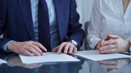 Business people and lawyers a contract papers before signing the agreement. Teamwork concept