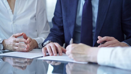 Business people and lawyers a contract papers before signing the agreement. Teamwork concept