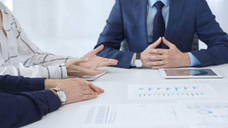 Professional team reviewing financial reports, collaborating on data analysis and strategic insights...
