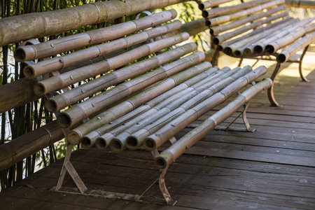 Eco style bamboo bench made of natural materials for sustainable interior or garden decoration,...