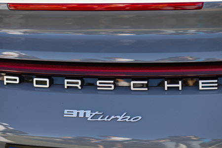 Wroclaw, Poland - June 21, 2025: Close up of Porsche 911 Turbo emblem and logo on rear of luxury...