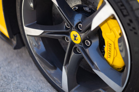 Wroclaw, Poland - June 21, 2025: Close up of Ferrari alloy wheel rim with prancing horse logo and...