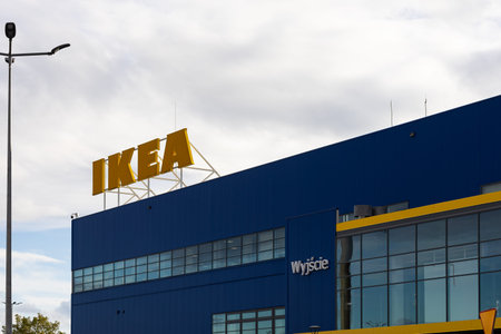 Wroclaw, Poland- October 25, 2025: Large yellow IKEA logo and brand signage on a blue building...