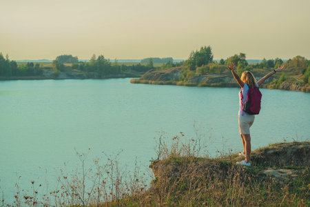 Young woman with pink backpackのeditorial素材