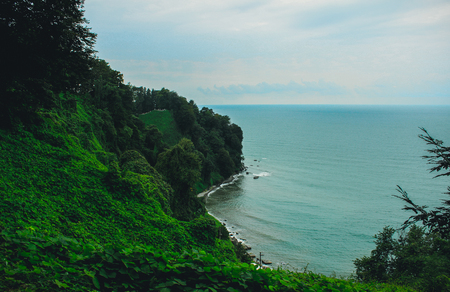 Top view of the sea coast with rail tracks from the observation platform of the Botanical Garden of Batumi, Georgia.の写真素材