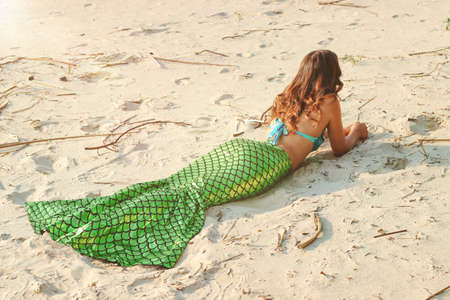 Young beautiful mermaid woman close up standing on the sea cost. Cosplay mermaid.の写真素材