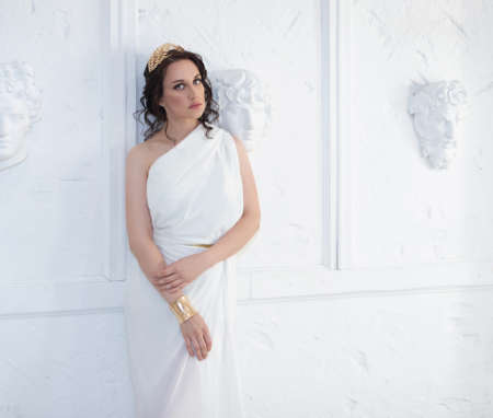 Beautiful Greek goddess woman close up on the white background.Greek style woman.の写真素材