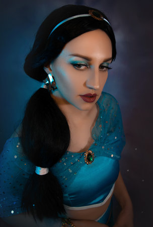 Beautiful princess closeup with magic lamp in her hands. Art photo.Jasmine princess cosplay.の写真素材