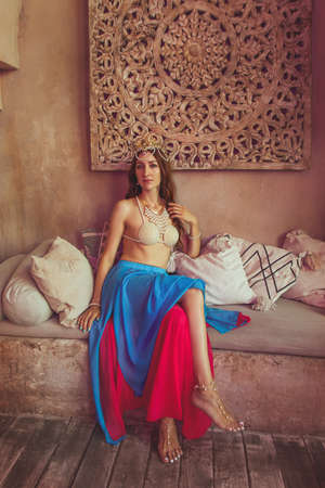 Beautiful lady in the dancing costume close up on the eastern architecture background. Mata Hari cosplay.の写真素材