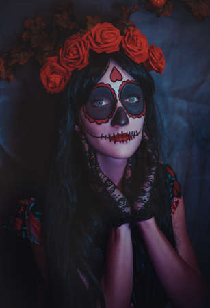 Beautiful woman with colored makeup closeup. Halloween mexican cosplayの写真素材