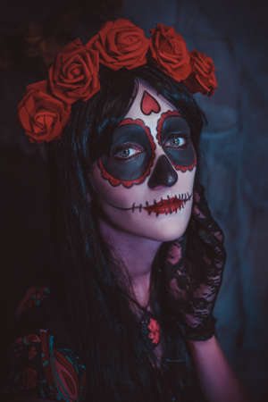 Beautiful woman with colored makeup closeup. Halloween mexican cosplayの写真素材