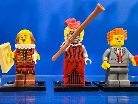 Minsk, Belarus - April 22, 2021 Lego constructor. Three toy human minifigures of entertainers on a blue background. The exhibits are made from Lego bricks.のeditorial素材